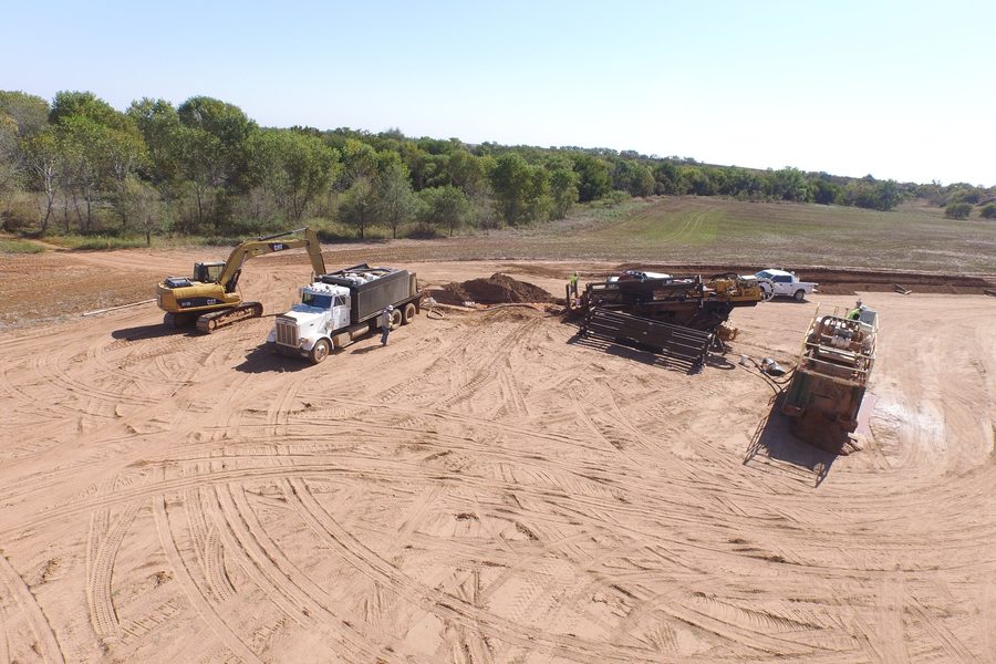 Directional drill rig, drill pipe and support equipment set up on a bore site