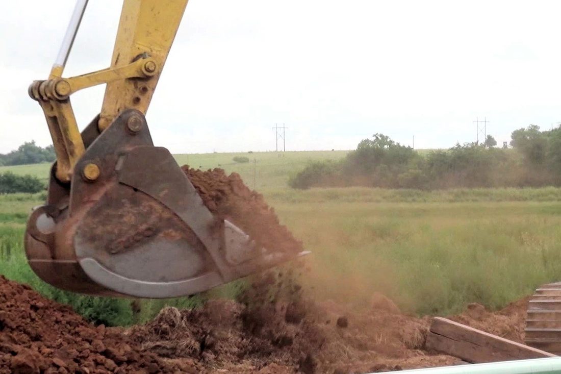 Excavation work on an open pipeline ditch