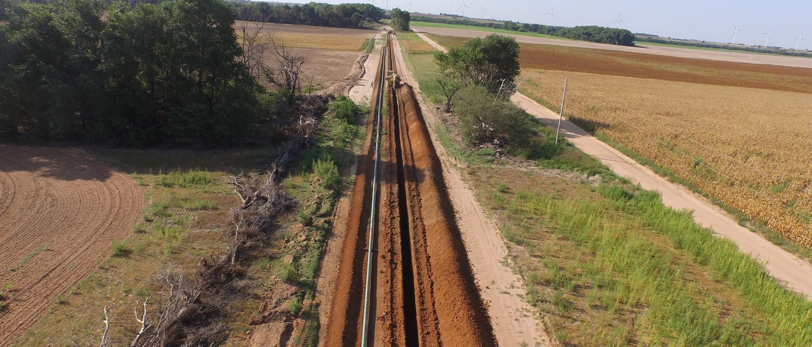 Aerial view of a Tucker Construction pipeline right-of-way graded and strung across Oklahoma farmland