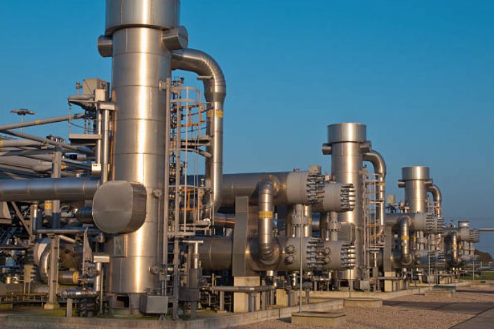 Compressor and processing equipment at a gas station facility